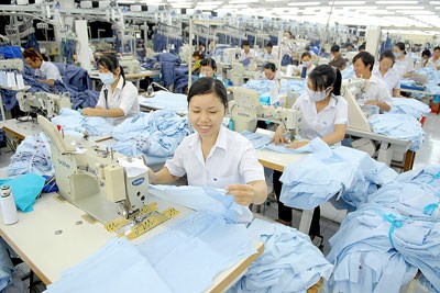 Garment production for export at Nha Be Corporation (Photo: SGGP)